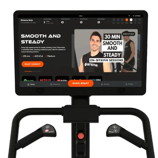 Close-up of the 27" HD touchscreen on the STEPR+ Stair Climber, showing workout options and streaming capabilities with 360º swivel and pivot features.