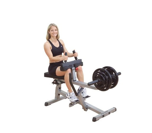 Female athlete working out on the Body-Solid GSCR349B Seated Calf Raise Machine, demonstrating proper use and form.