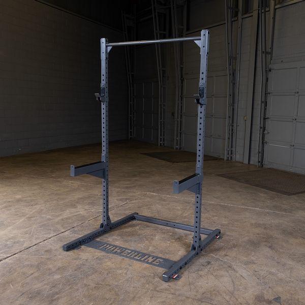 Front view slightly angled of the Powerline PPR500 Half Rack by Body-Solid for home gym use in warehouse